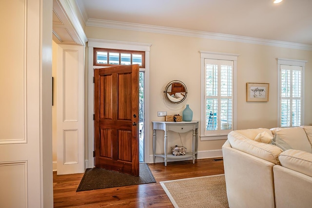 entryway with dark wood-type flooring and crown molding