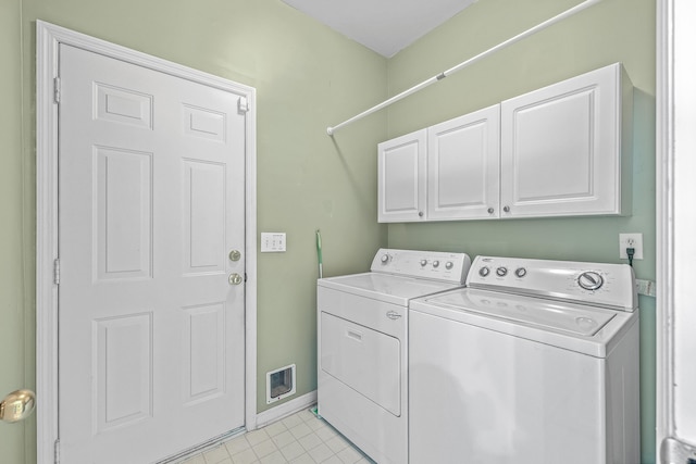 laundry area with cabinets and washer and dryer