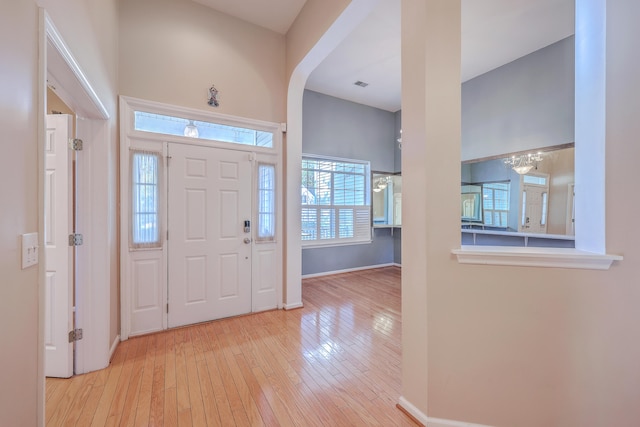 entryway featuring a wealth of natural light and light hardwood / wood-style flooring