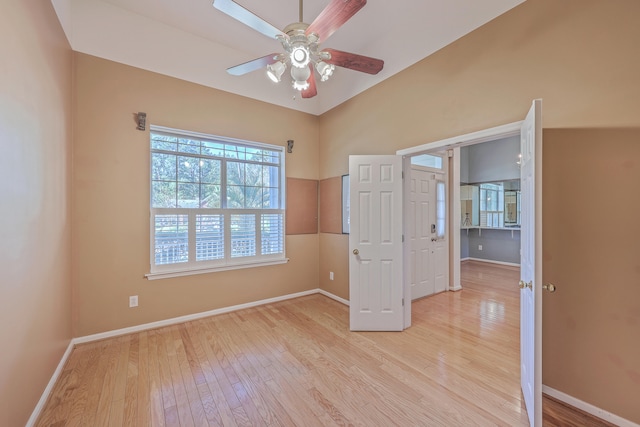 unfurnished bedroom with ceiling fan and light hardwood / wood-style flooring