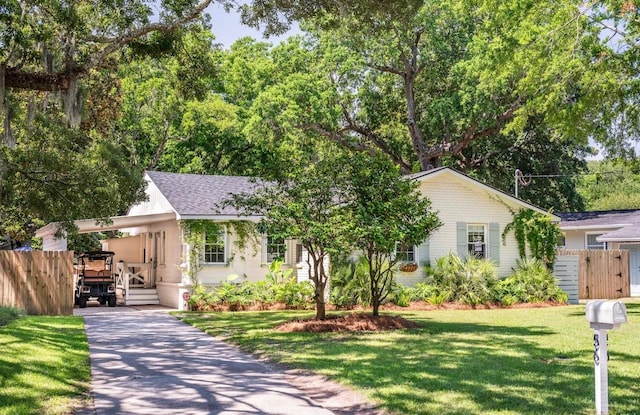 56 Vincent Dr, Mount Pleasant, SC 29464 - view of front facade with a carport, concrete driveway, and a shingled roof
