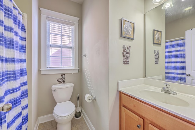 full bathroom featuring tile patterned floors, baseboards, toilet, and vanity