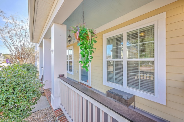 view of side of property with covered porch