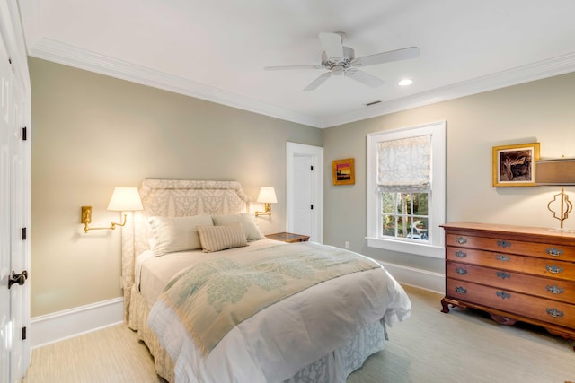 carpeted bedroom featuring ceiling fan and ornamental molding