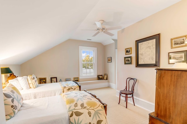 bedroom with light carpet, vaulted ceiling, and ceiling fan