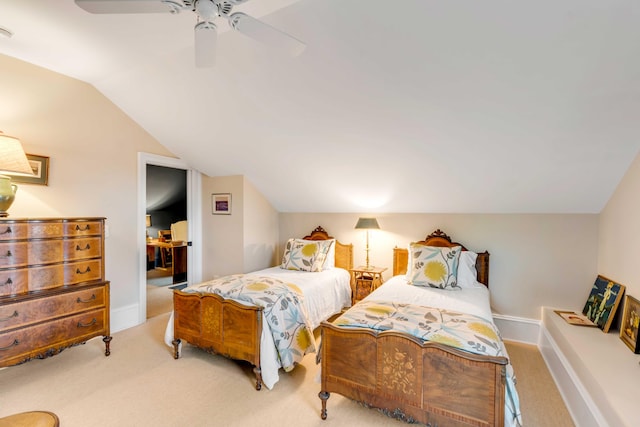 bedroom featuring light colored carpet, vaulted ceiling, and ceiling fan