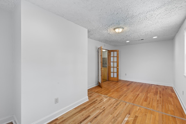 1593 Westwood Dr, Charleston, SC 29412 - empty room with a textured ceiling, light wood-style flooring, baseboards, and recessed lighting
