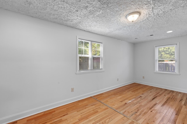 1593 Westwood Dr, Charleston, SC 29412 - spare room featuring light wood finished floors, baseboards, and a textured ceiling