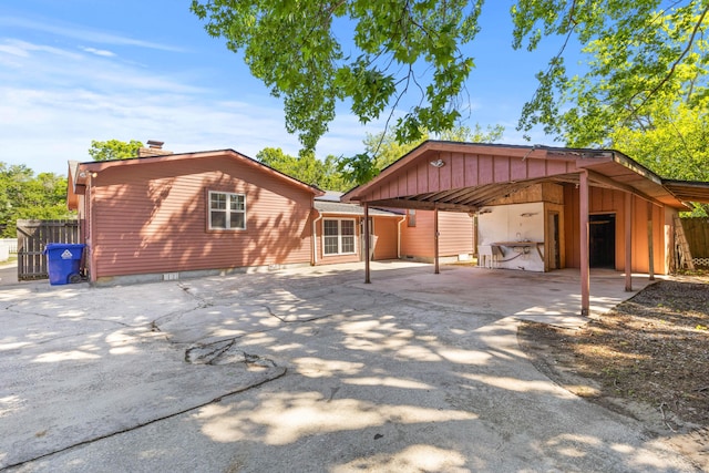 1593 Westwood Dr, Charleston, SC 29412 - back of property with a carport, concrete driveway, and a chimney
