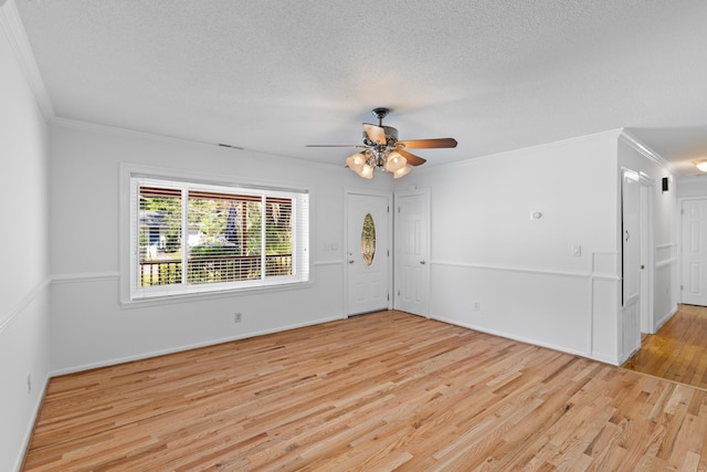 1593 Westwood Dr, Charleston, SC 29412 - empty room featuring light wood-style floors, ornamental molding, ceiling fan, a textured ceiling, and baseboards