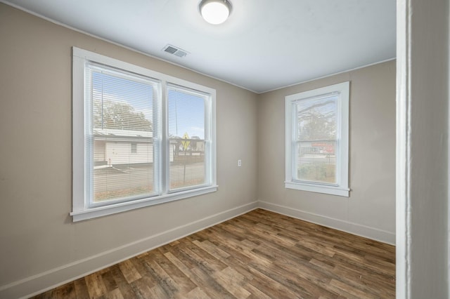 spare room featuring hardwood / wood-style flooring