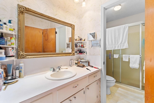 bathroom with wallpapered walls, toilet, a stall shower, vanity, and tile patterned floors