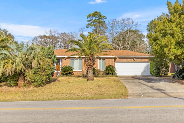 view of front of house with a garage, driveway, brick siding, and a front yard