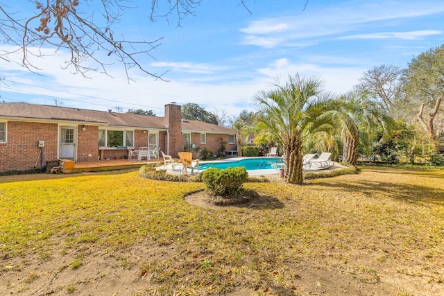 view of yard with a patio and an outdoor pool