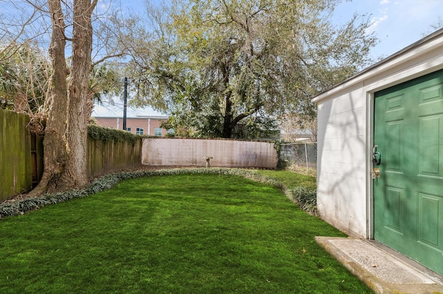 view of yard with a fenced backyard