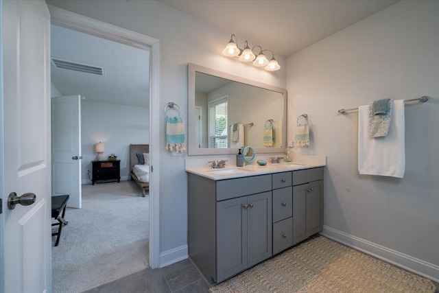 2017 Geranium Ln, Johns Island, SC 29455 - ensuite bathroom featuring double vanity and baseboards