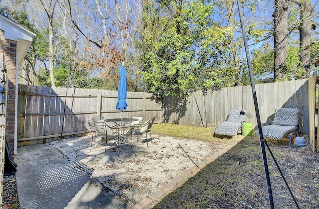 view of patio / terrace with a fenced backyard and outdoor dining area