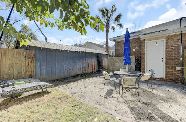 view of patio / terrace featuring outdoor dining space and fence