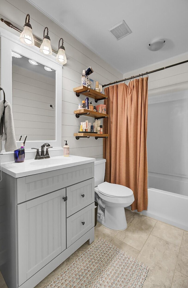 bathroom featuring shower / tub combo, visible vents, vanity, and toilet