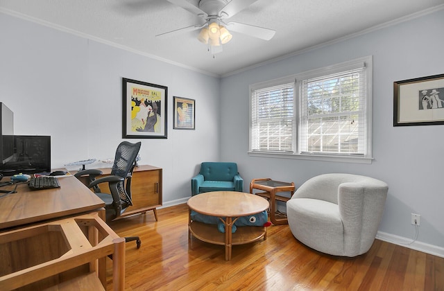 office featuring ceiling fan, baseboards, wood finished floors, and crown molding