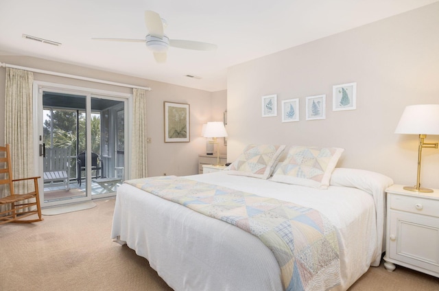 bedroom featuring light carpet, access to outside, visible vents, and ceiling fan