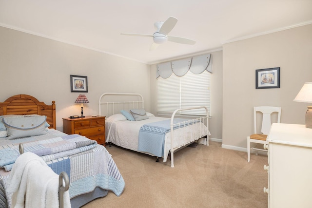 bedroom featuring light carpet, ceiling fan, baseboards, and crown molding