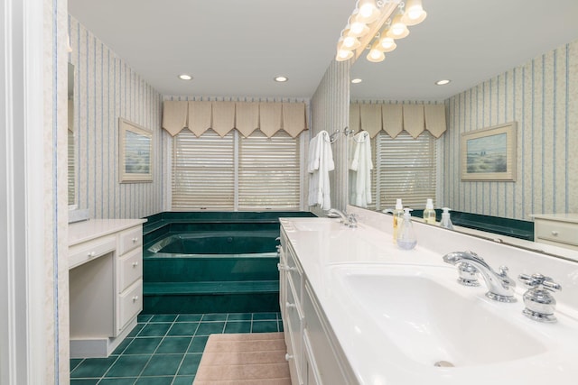 bathroom featuring wallpapered walls, tile patterned flooring, and a sink