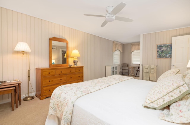 bedroom with light carpet and ceiling fan