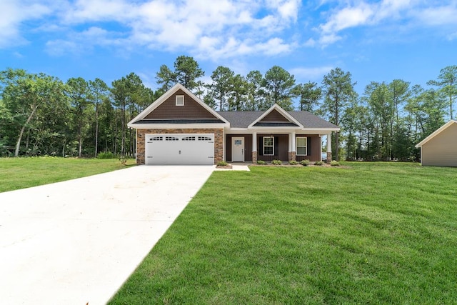 craftsman house featuring a front yard, a garage, and a porch