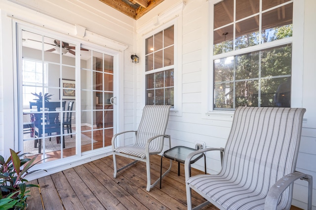 wooden deck with ceiling fan