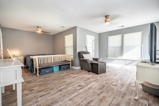 bedroom featuring light hardwood / wood-style floors and ceiling fan