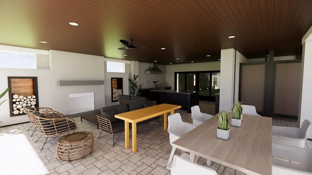 11 Tabby Ln, Isle Of Palms, SC 29451 - interior space with a ceiling fan, an outdoor living space with a fireplace, and outdoor dining area