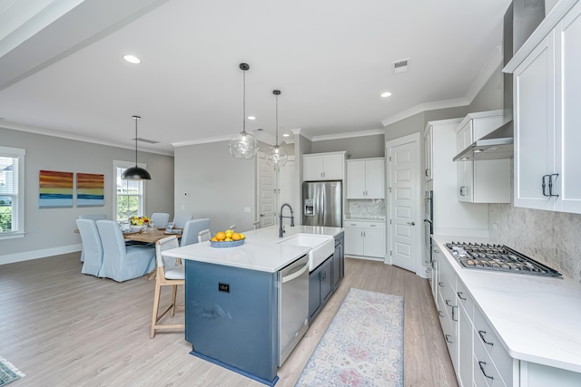 2282 Braided Ln, Mount Pleasant, SC 29466 - kitchen with visible vents, a sink, ornamental molding, appliances with stainless steel finishes, and backsplash