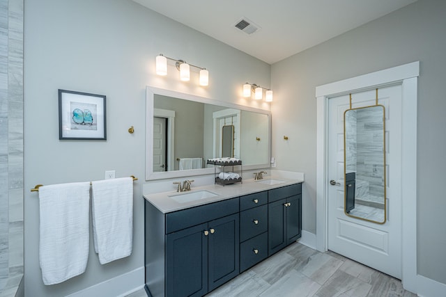 2282 Braided Ln, Mount Pleasant, SC 29466 - bathroom with a sink, visible vents, double vanity, and tiled shower