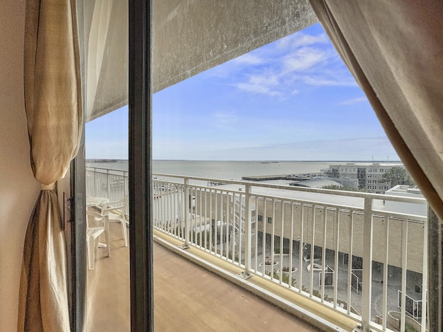 balcony featuring a water view