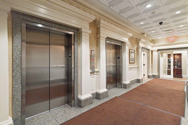 interior space with ornamental molding, granite finish floor, recessed lighting, and elevator