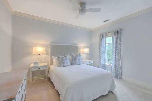 carpeted bedroom featuring ceiling fan and ornamental molding