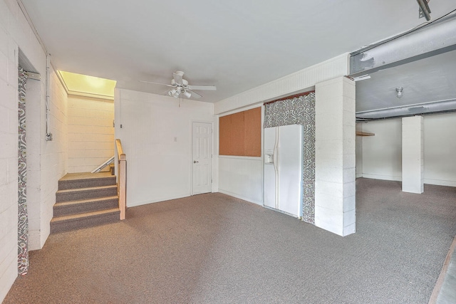 basement with ceiling fan and carpet flooring