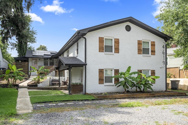 4619 Jenkins Ave Unit 1-4, North Charleston, SC 29405 - view of front of house featuring brick siding, roof mounted solar panels, and stairway