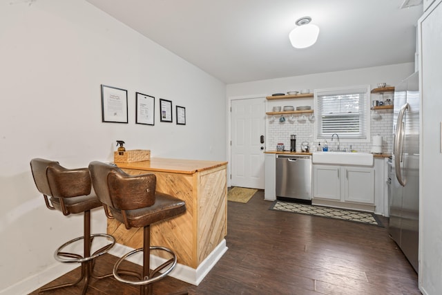 4619 Jenkins Ave Unit 1-4, North Charleston, SC 29405 - indoor bar with stainless steel dishwasher, fridge, decorative backsplash, and dark wood-style floors