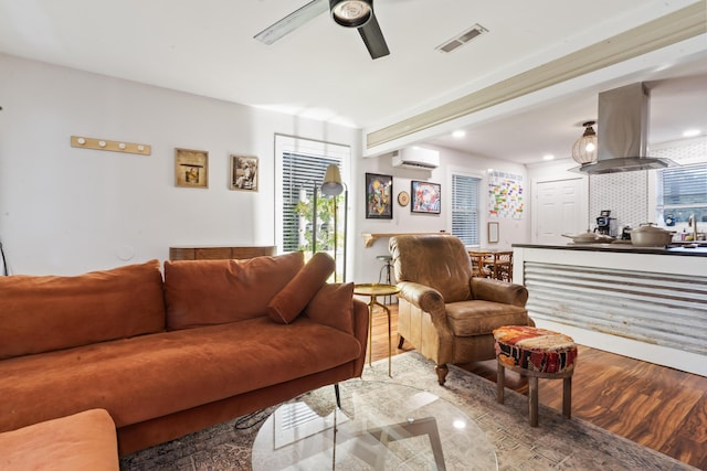 4619 Jenkins Ave Unit 1-4, North Charleston, SC 29405 - living area with an AC wall unit, a ceiling fan, wood finished floors, plenty of natural light, and recessed lighting