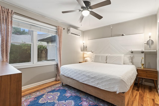 4619 Jenkins Ave Unit 1-4, North Charleston, SC 29405 - bedroom with a wall mounted AC, wood finished floors, baseboards, and a ceiling fan