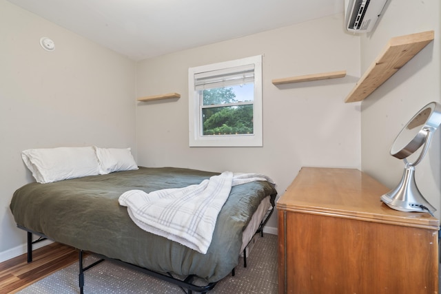4619 Jenkins Ave Unit 1-4, North Charleston, SC 29405 - bedroom with baseboards, a wall unit AC, and wood finished floors