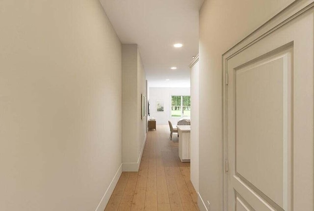 hallway with light hardwood / wood-style floors