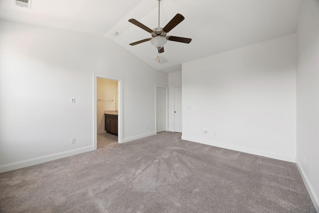 carpeted spare room with vaulted ceiling and ceiling fan