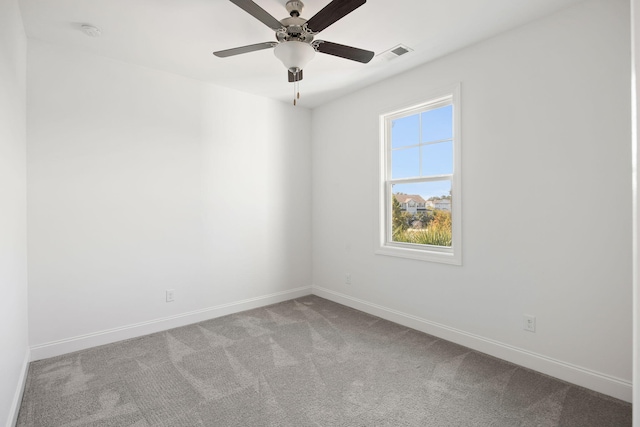 spare room with light carpet and ceiling fan