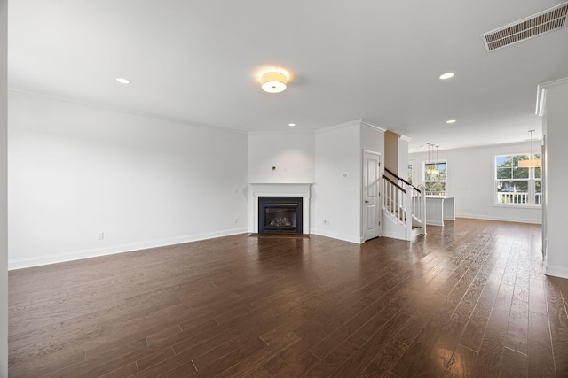 unfurnished living room with dark wood-type flooring and ornamental molding