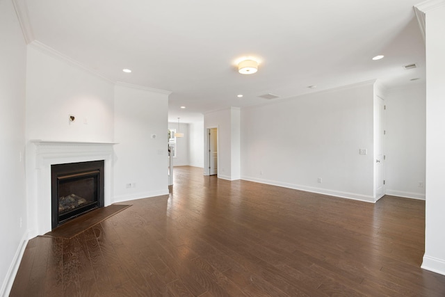 unfurnished living room with ornamental molding and dark hardwood / wood-style flooring