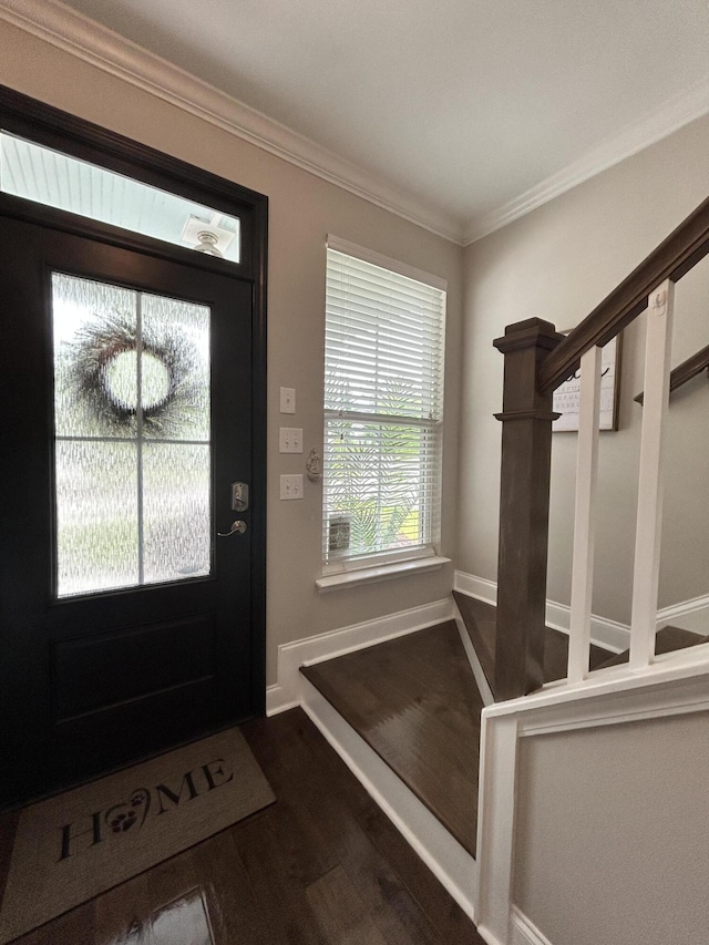 entryway with dark wood-style floors, baseboards, and crown molding
