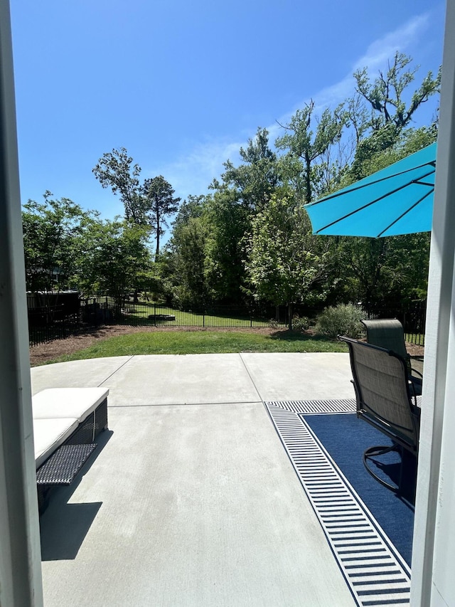 view of patio / terrace featuring fence